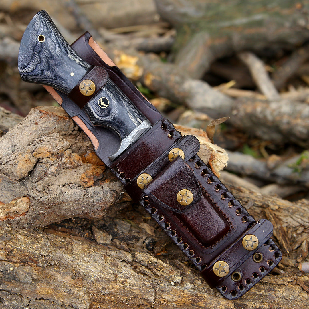Brown leather holster with gold studs on a wooden surface
