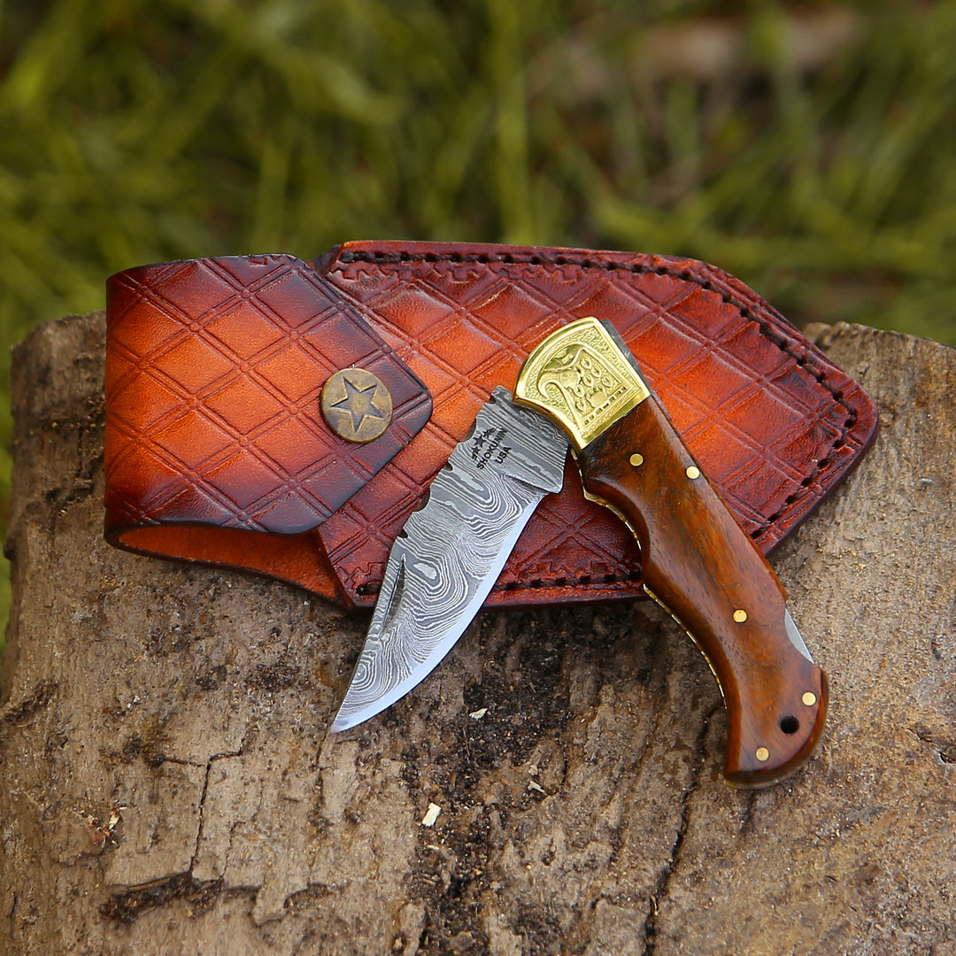 Knife with a brown leather sheath on a wooden surface