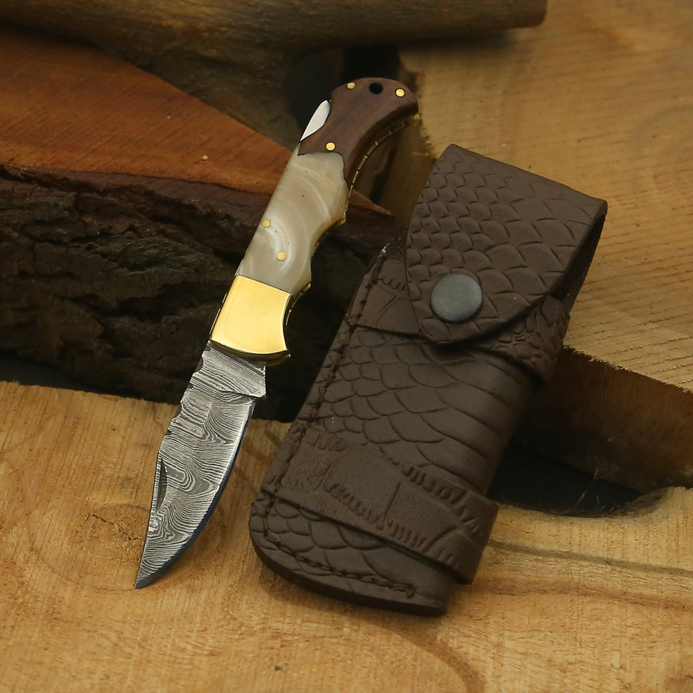 Showing Pocket Knife close up being held in hand
